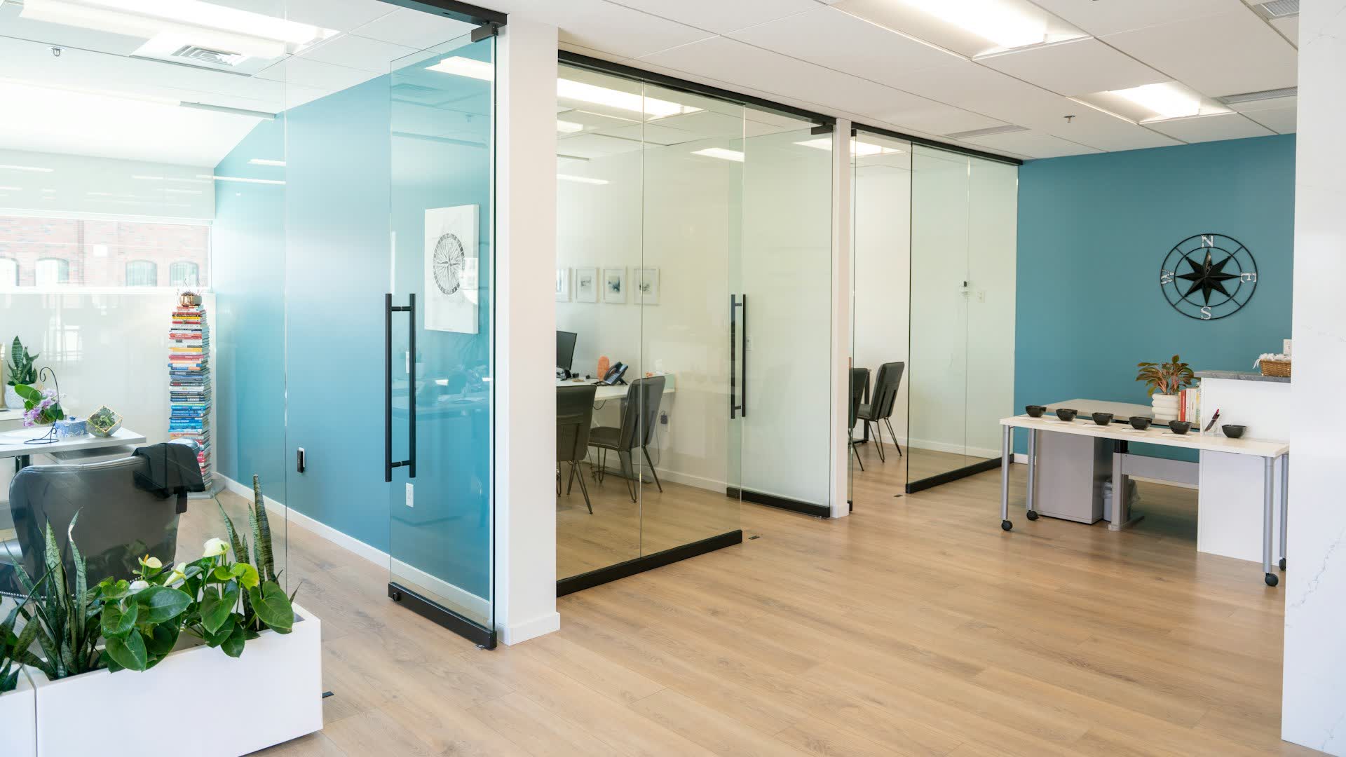 Bright modern office with glass-walled meeting rooms