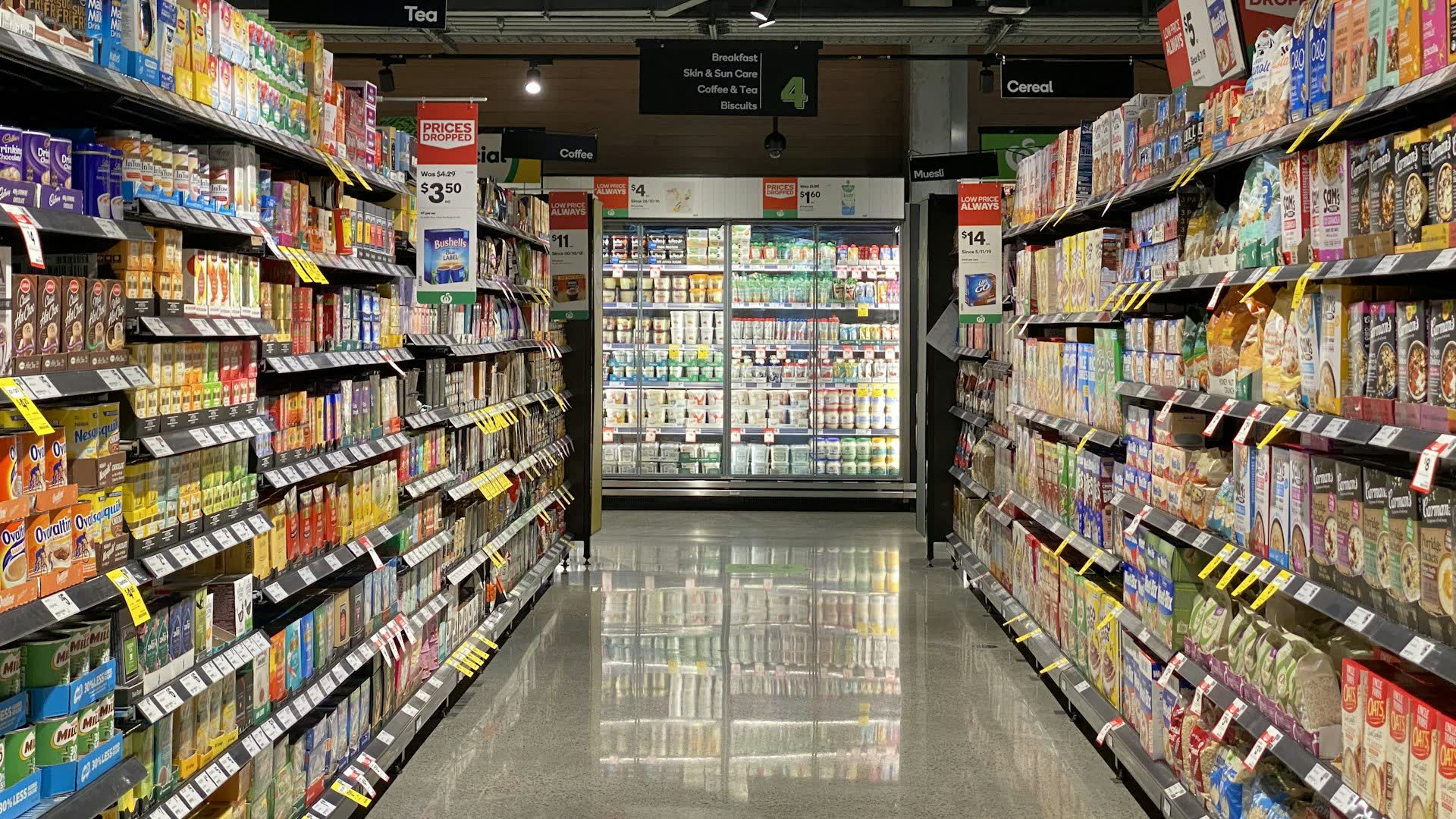 Supermarket aisle with fully stocked shelves