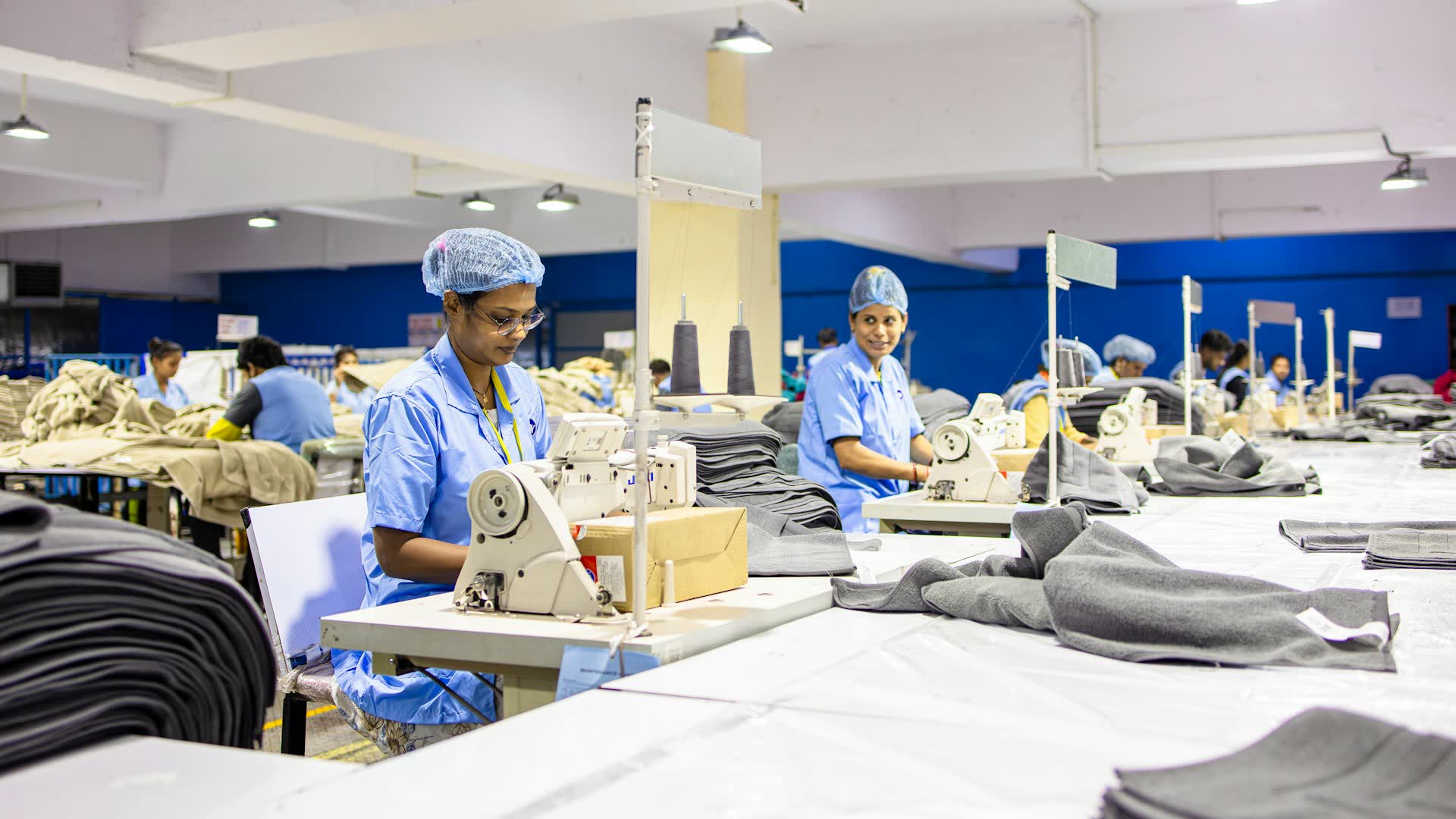 Garment factory floor with workers at sewing machines