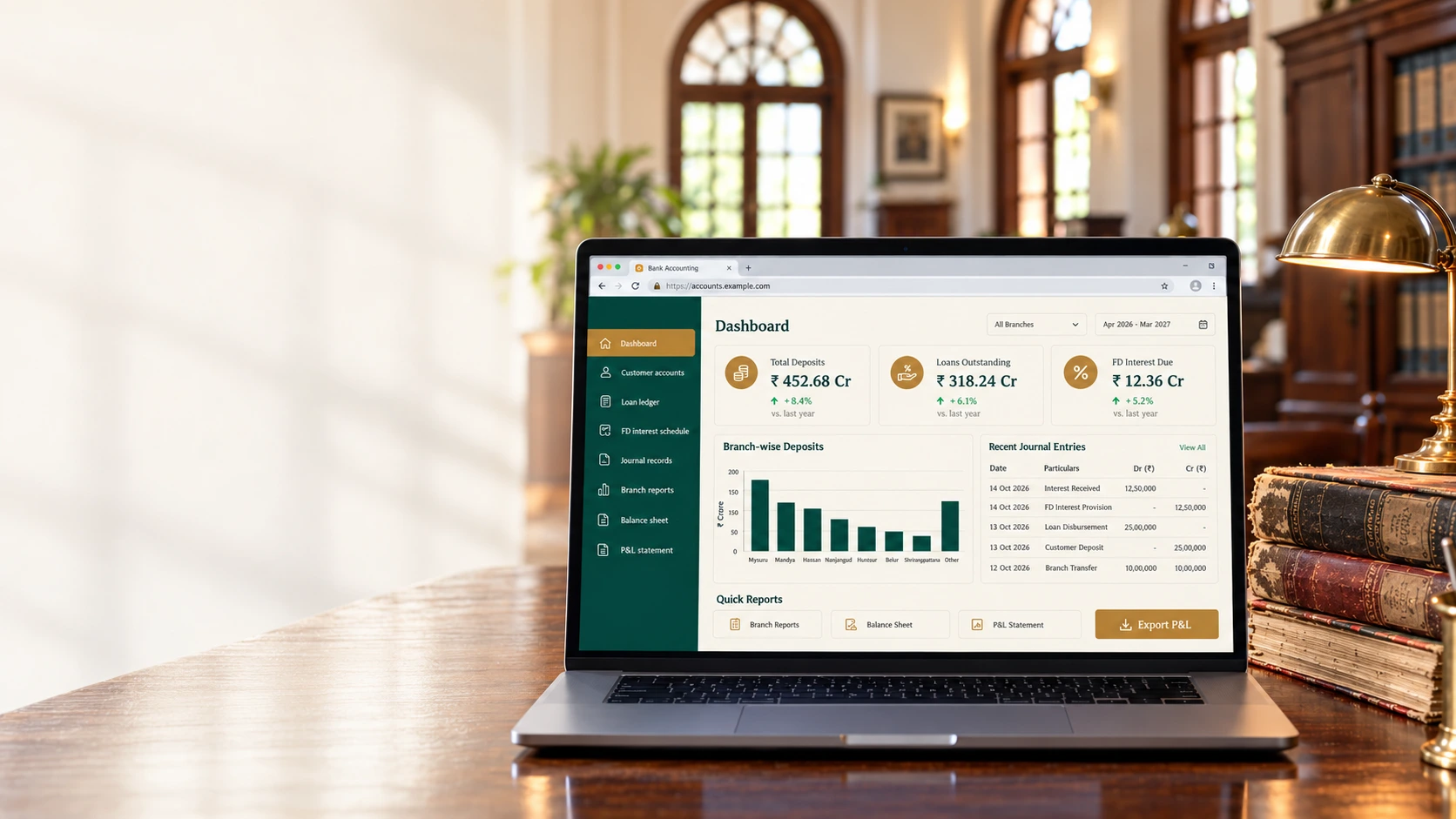 Laptop on a teak desk in a heritage bank office, showing the branch accounting dashboard beside old ledgers and a brass lamp